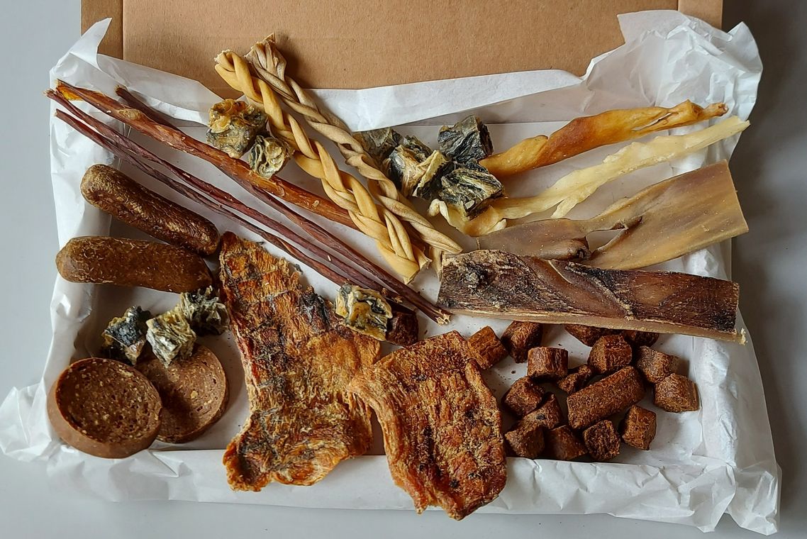 a box of natural dog treats displayed for letterbox delivery
